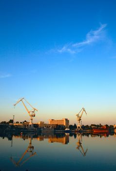 Wide-angle photo of cranes in a shipbuilding plant