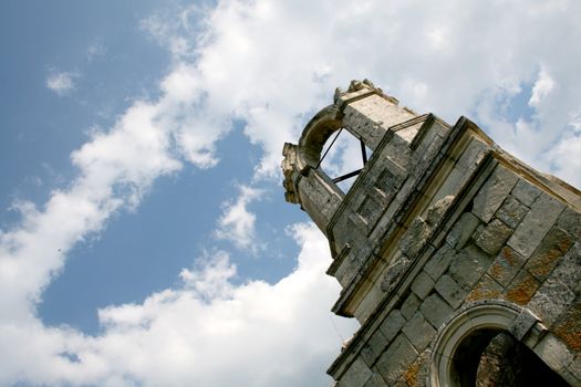 Ruins of an old church on sky background