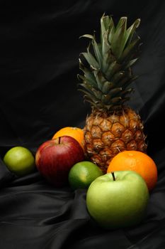 Studio photo of fresh fruits on black background