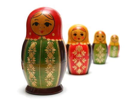 Traditional russian matreshka toys in a row, with focus on first figure