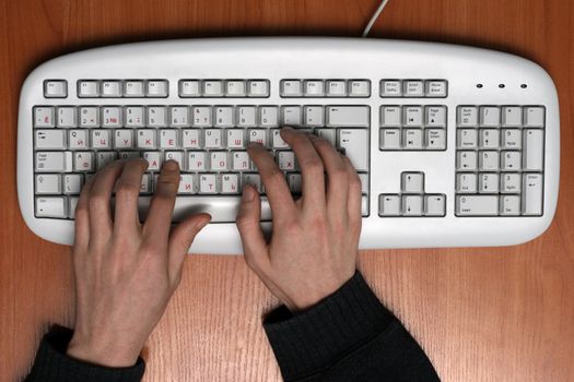 Person typing something on computer keyboard
