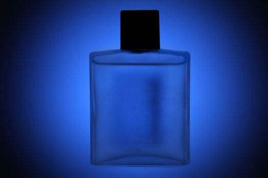 Generic perfumes flask over blue background