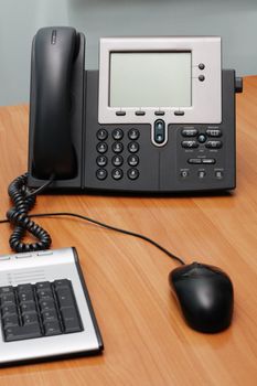 Modern digital phone on office table