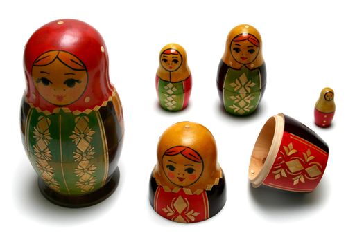 Disassembled russian matreshka toys isolated on white background