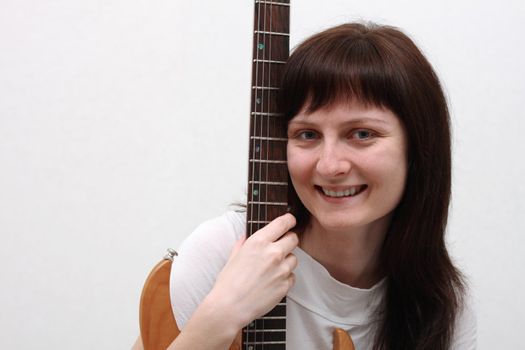 Portrait of a girl holding an electric guitar