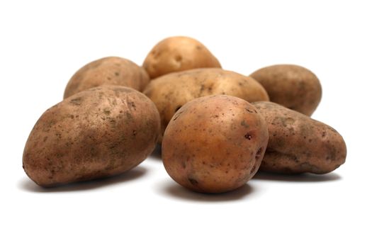 Closeup shot of raw organic potatoes heap