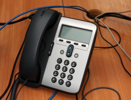 IP Phone and comuter keyboard on desktop