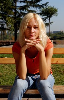 Beautiful girl in a park, looking at camera