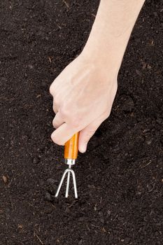 Close up image of cultivating soil