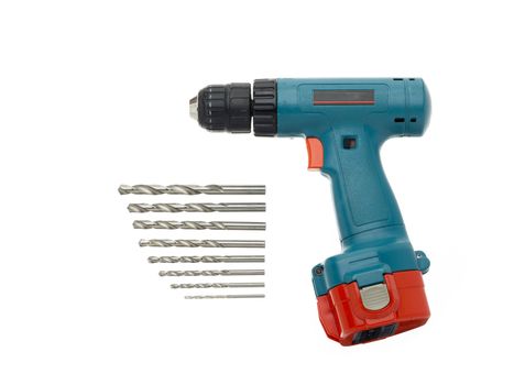 A powerdrill with drill bits of different sizes lined up