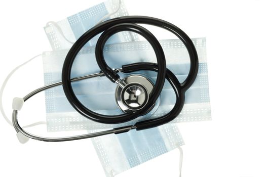 Stethoscope and surgical mask displayed over white.