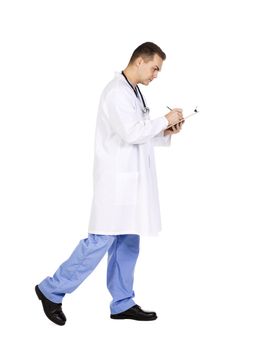 Professional healthcare walking and writing on the clipboard 