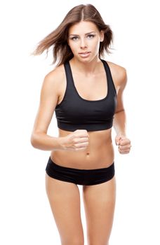 Young woman running in sports outfit, isolated on white background