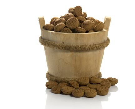 wooden sauna bucket with dutch pepernoten candy for children with sinterklaas party on 5 december