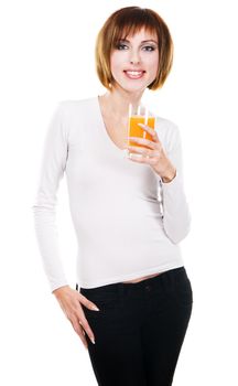 Lovely young woman with a glass of fresh juice against white background