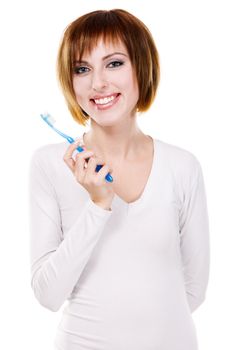 Beautiful young woman holding toothbrush, white background 