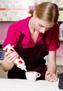 Friendly waitress making coffee at coffee machine