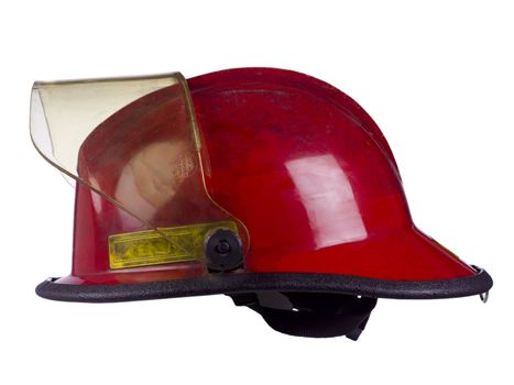 Red protective helmet for firemen isolated in a white background