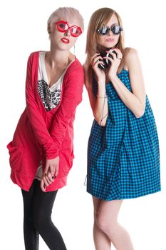 Lovely teenage girls having fun together, white background