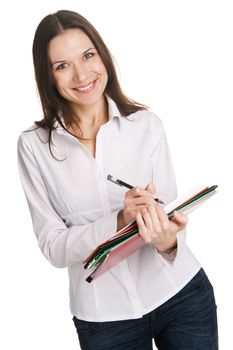 Young businesswoman with a bunch of documents writing at note pad, white background 