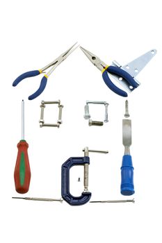 Close up image of house made of assorted kinds of tools against white background