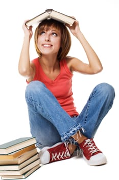 Lovely student girl with a stack of books, white background