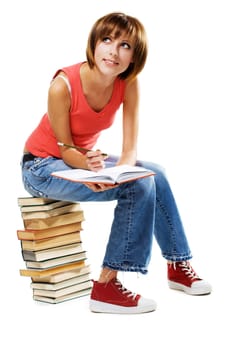 Lovely student with a lot of books, isolated on white 