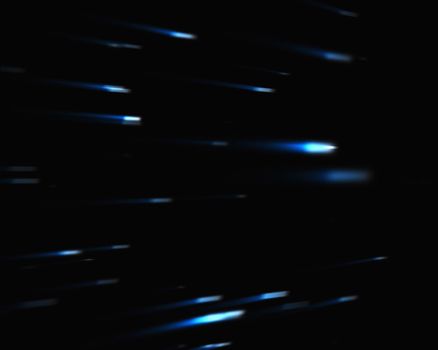 Blue falling stars against black background