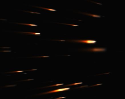 Orange falling stars against black background