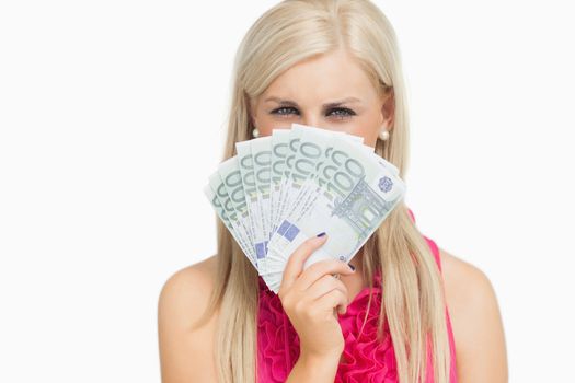 Beauty holding 100 euros banknotes against white background