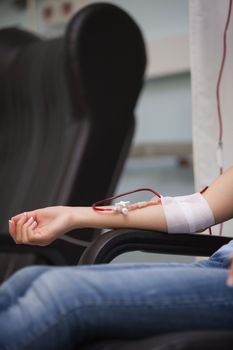 Woman donating blood in hospital