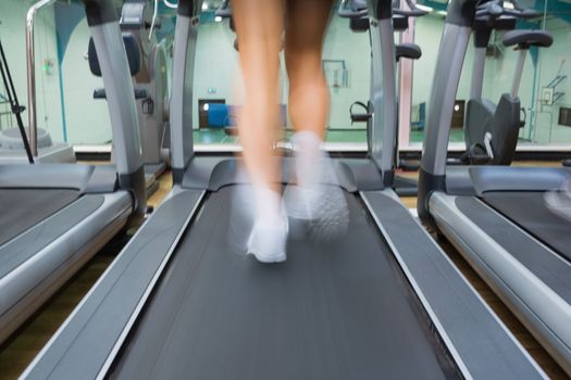 Running on a treadmill in the gym