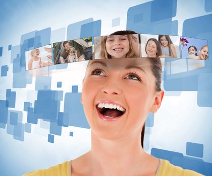 Smiling woman looking at picture bar on blue background
