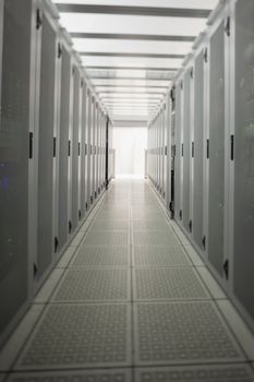 Hallway with a row of servers in data center