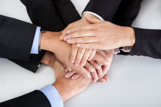 Closeup of a business colleagues with their hands stacked together
