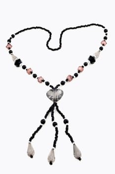 The necklace with black and manycollor stone in love on isolated.
