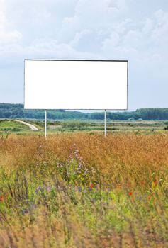 Empty advertisement board on a field