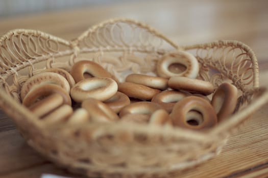 Wicker basket with bread-rings on the table