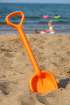 Toy shover at the beach on a sunny day