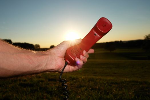 red phone in landscape