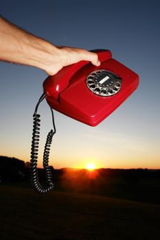 red phone in landscape
