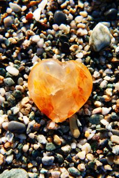 Red heart, symbol of love in the sand. Red heart, symbol of love in the sand.