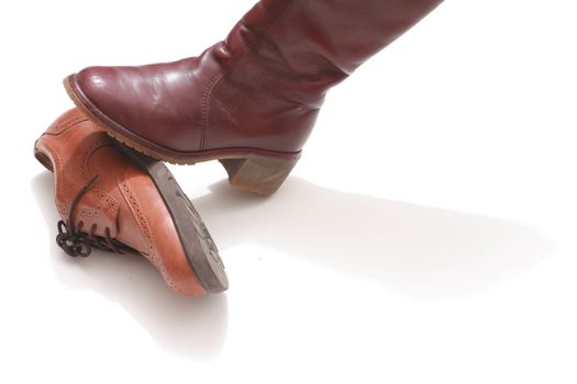 Domination symbolized by shoes on white background Domination symbolized by shoes on white background