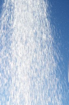 water drops falling from a shower outside