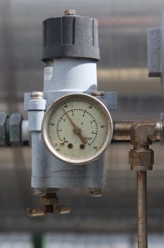 Old pressure gauge in industrial plant
