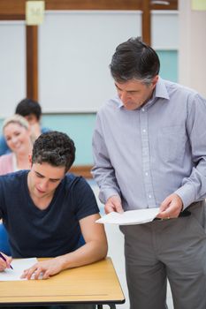 Teacher talks to a student at the classroom 