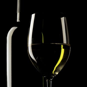 white wine glass silhouette black background