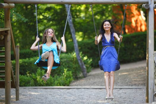 young women swinging