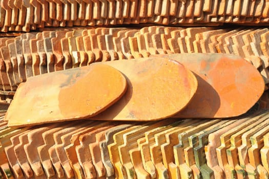 View of a stack of pattern of the roof tiles in old temple, Bangkok, Thailand.