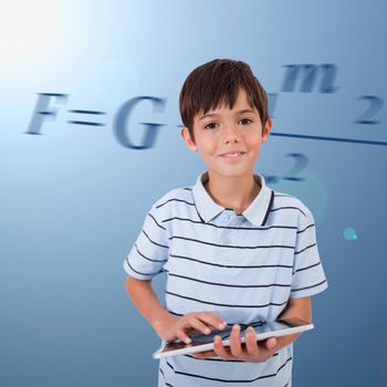 Male pupil with tablet pc on background with maths formula